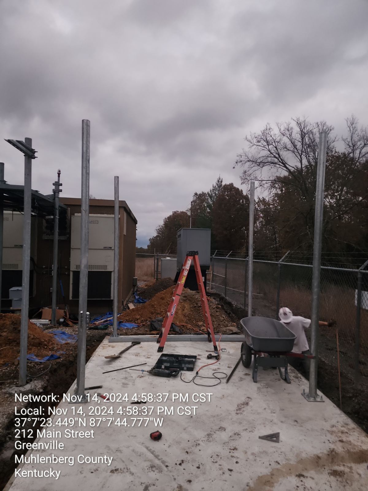 Equipment installation: Ground-mounted telecom cabinets and power infrastructure.